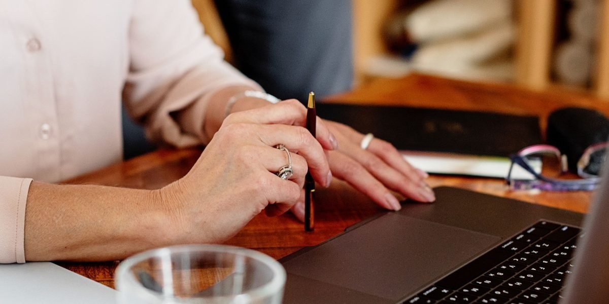 Editors reviewing nutrition research on laptops